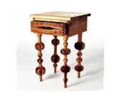 Side table with unique turned globe legs in maple and fruit wood, bookmatched live edge drawer