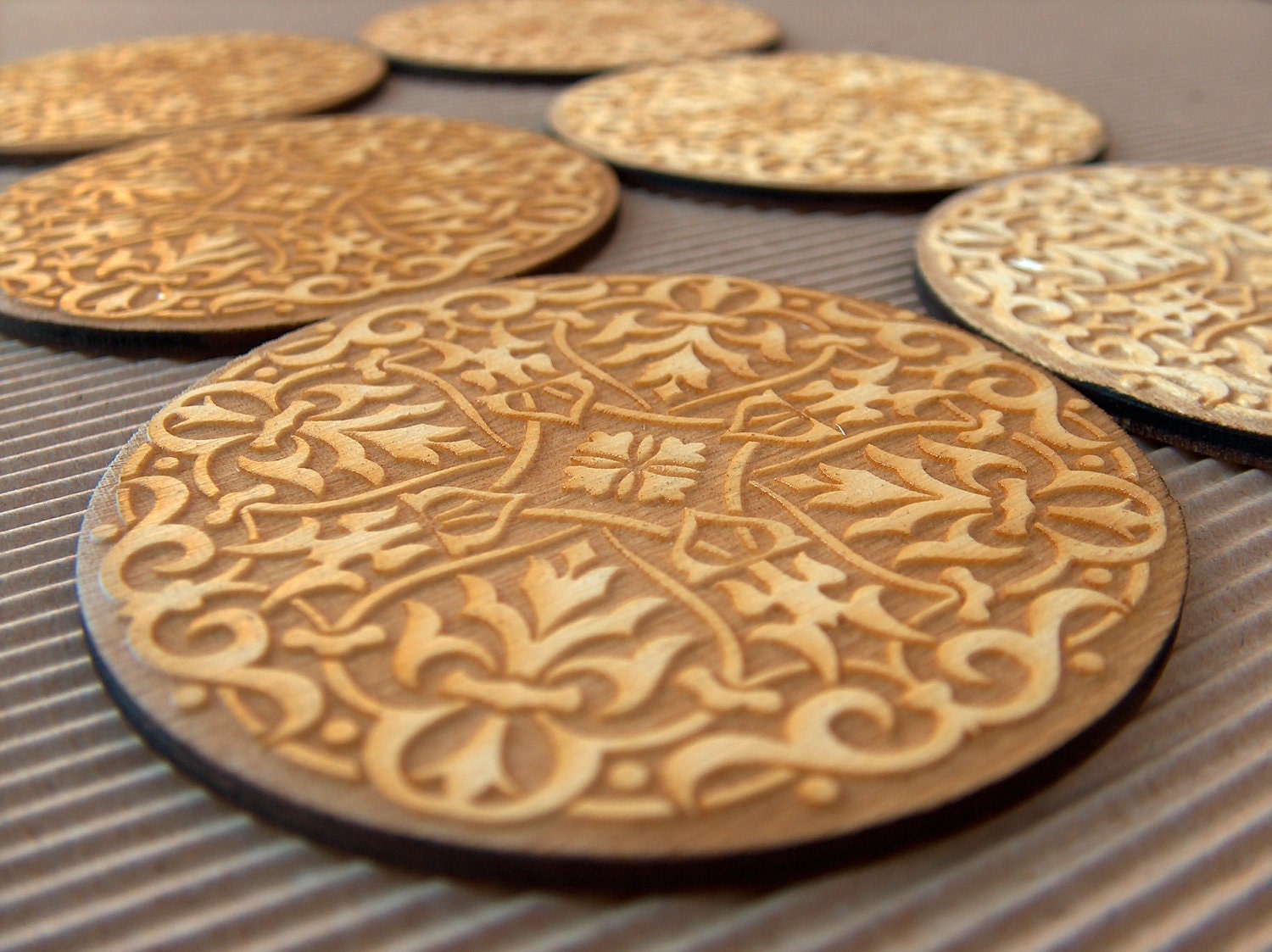 Engraved and cut  wooden coasters set