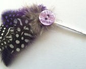 Super cute, purple and black and white feathers with a purple button on heavy duty silver bobby pins.Perfect for weddings and prom.