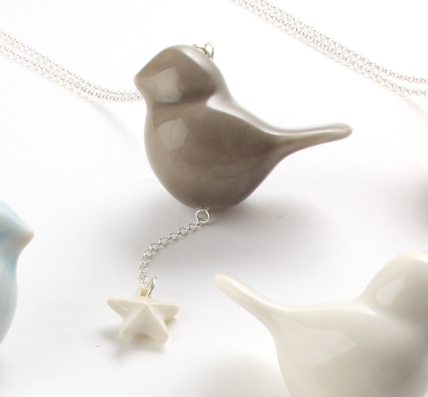 Porcelain and silver bird necklace, grey bird with white star.
