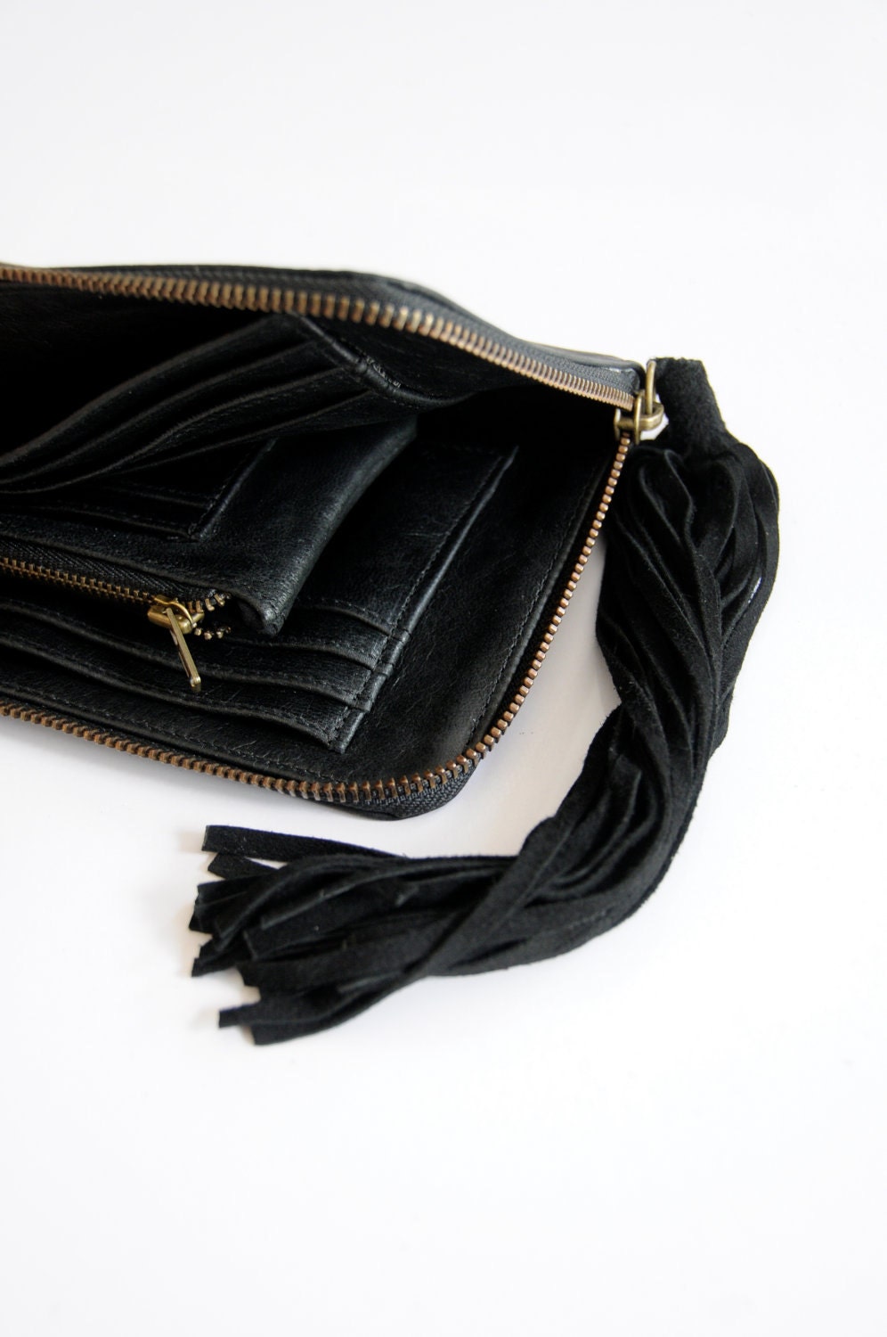 COSMO. Classy leather clutch / wallet with suede tassel. Available in different leather colors.