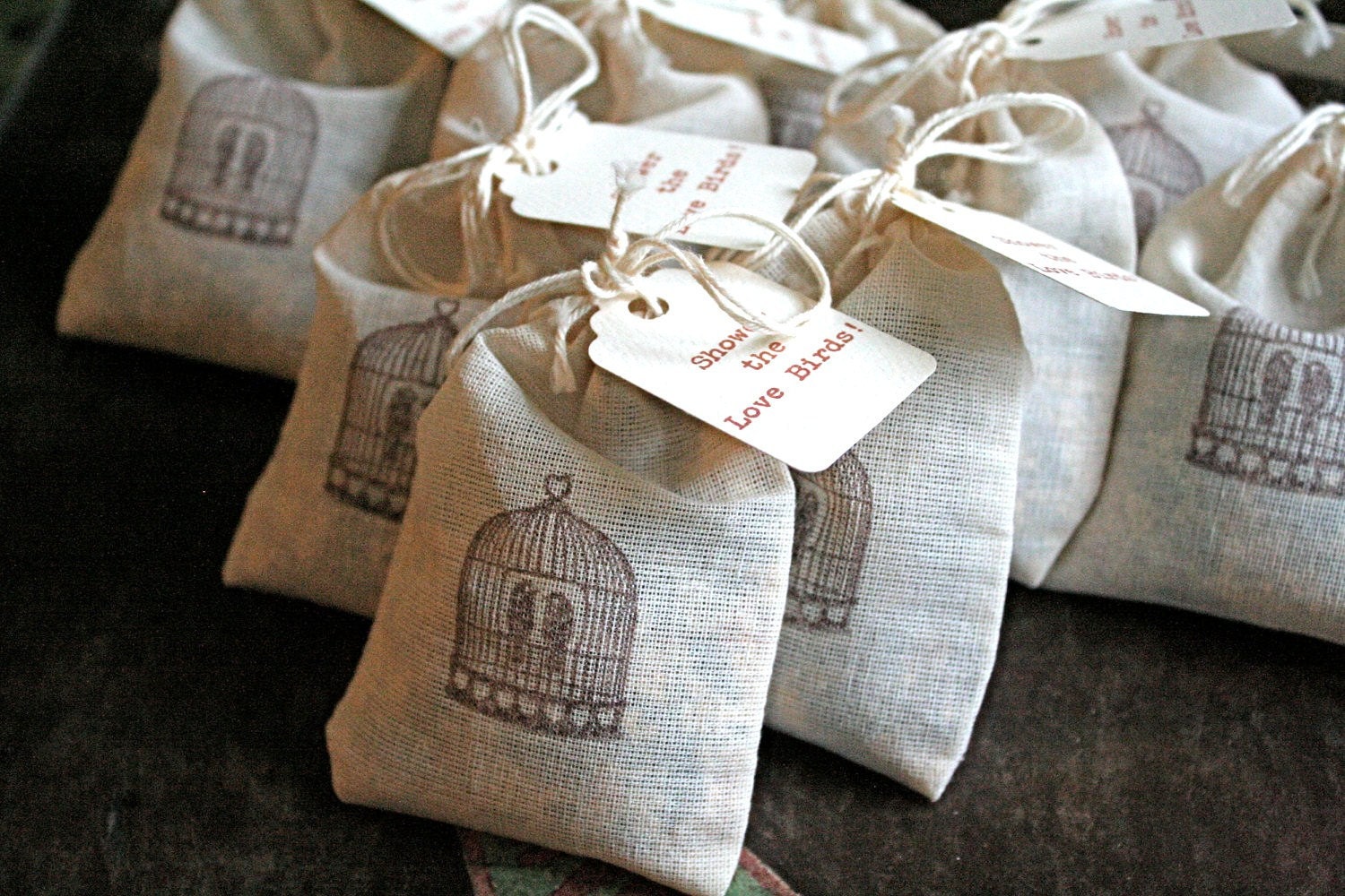 Wedding favor, bird seed toss favors. 50 muslin bags, 2x4, flilled with bird seed. Bird cage design and lovebird tag.