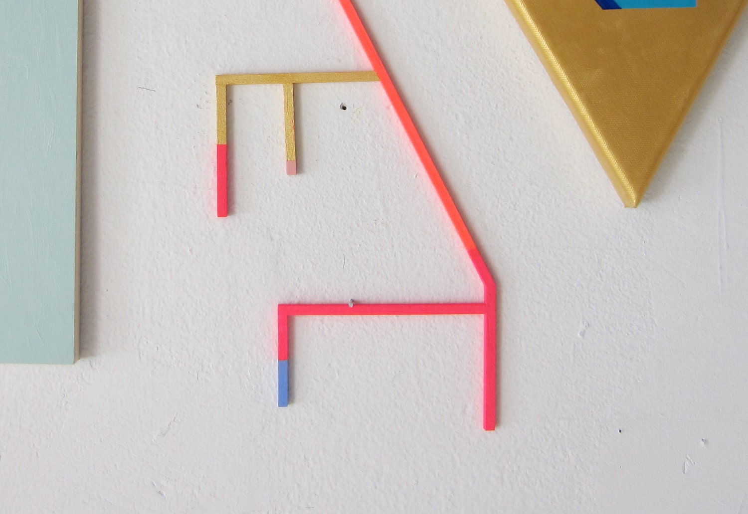 Neon geometric art, abstract painting, unusual stick painting on wood