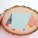 Wood wall art geometric pastel tree slice painting with colorful abstract shapes and stripes: original art