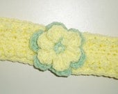Little girl's yellow headband with flower