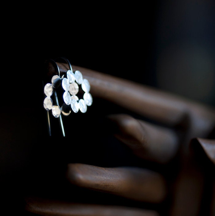 Sterling silver earrings. Hammered dots in a oval shape.