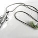 Stainless steel fork pendant on grey suede cord