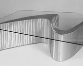 Form Table futuristic coffee table is aluminum and glass