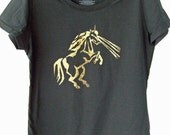 Unicorn shooting laser beams in black and gold womens t shirt