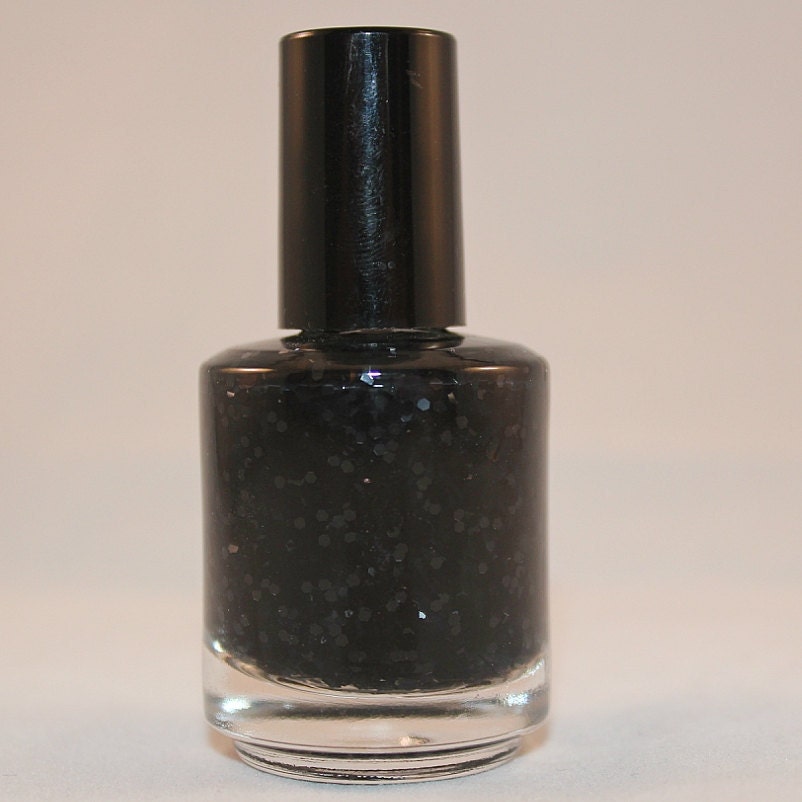Spotty Dottie Dark - clear base with black glitter nail polish