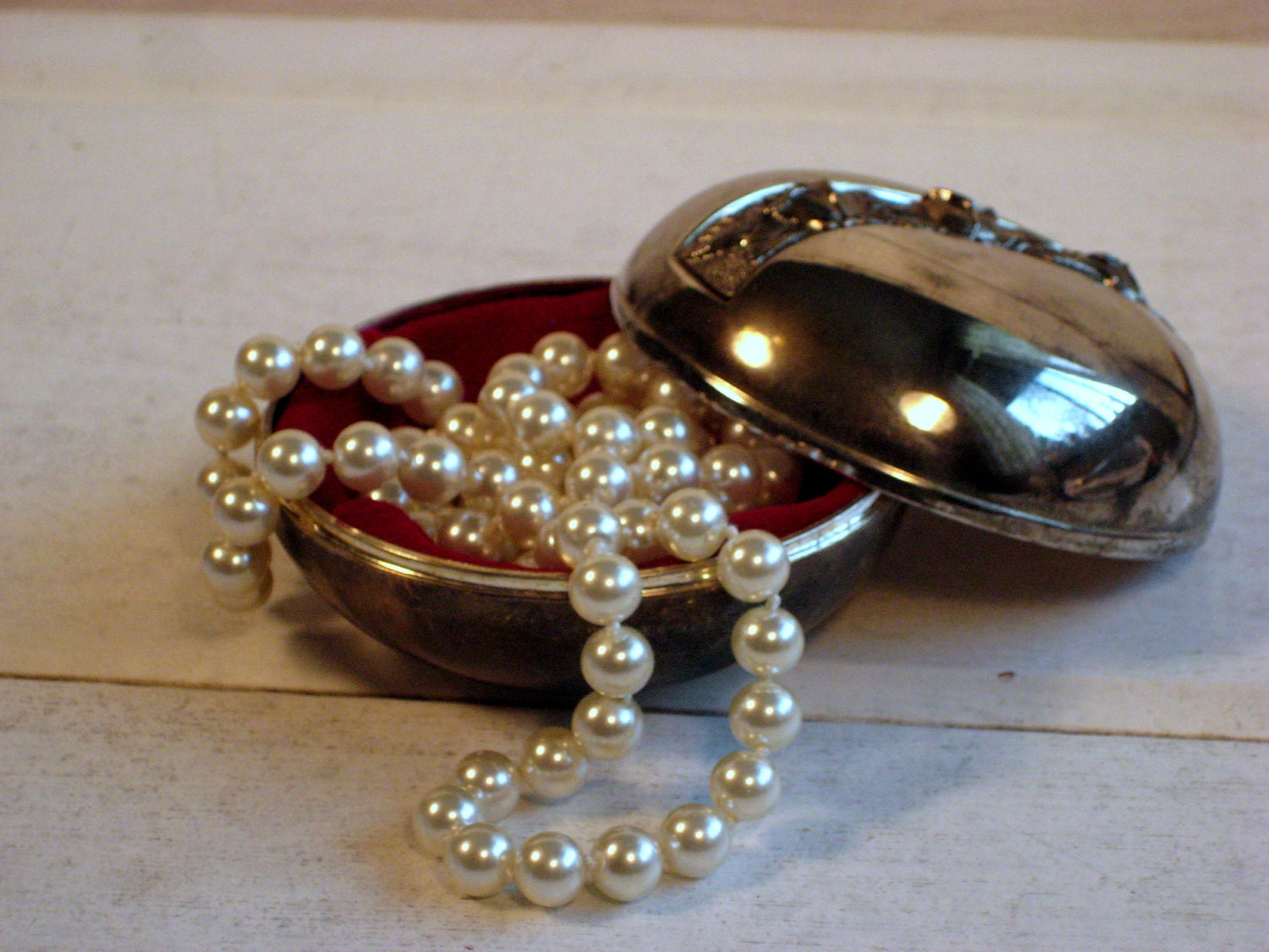 Vintage Silver plate jewelry box with red velvet lining and an aged patina