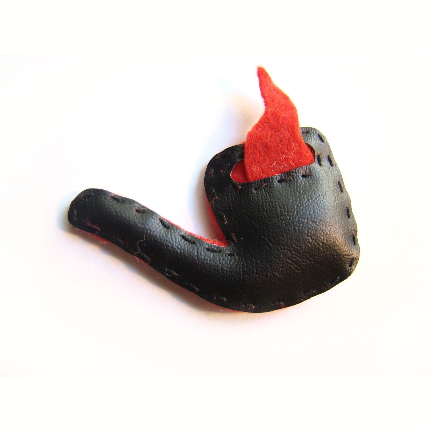 black pipe brooch with red smoke