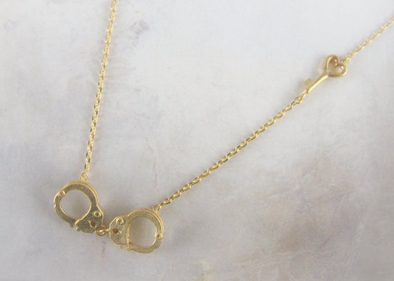 gold handcuff necklace with heart key
