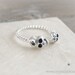 tiny silver skull heads ring