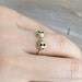 tiny gold skull heads ring