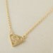 gold superman necklace