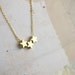 trio star necklace in gold