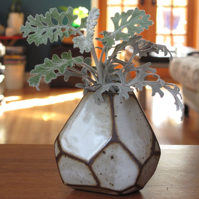 Faceted brown and white vase.