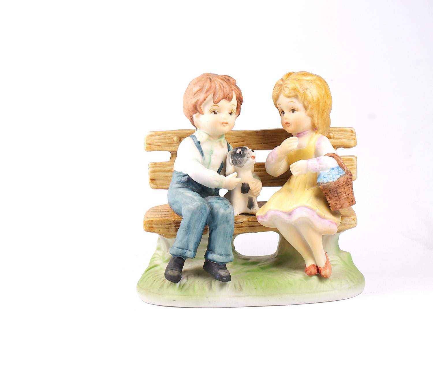 Vintage pastels porcelain figurines. Children and dog.