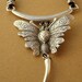 PIECE UNIQUE - Collier papillon monté sur cuir brut couleur chocolat
