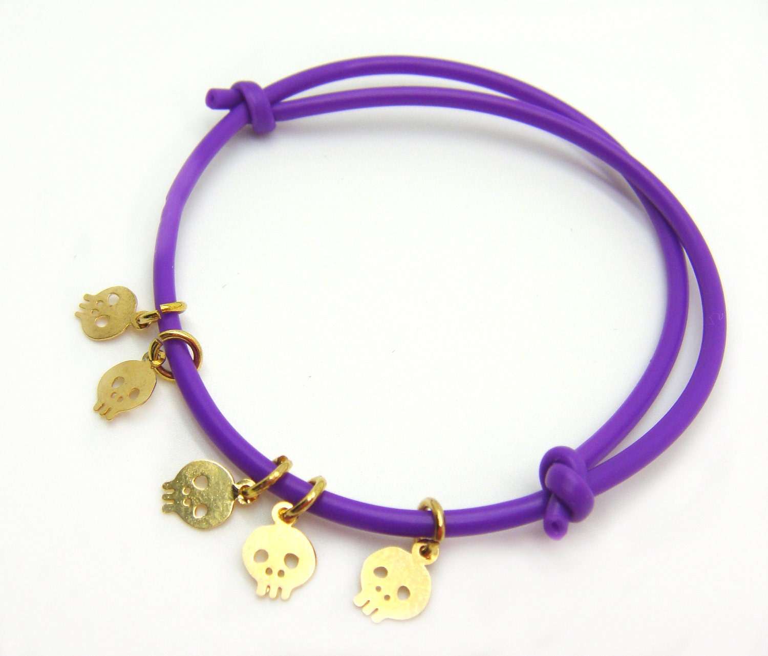 Neon Tiny Skull Bracelet - Rubber Bracelet W/ 5 Tiny Gold Plated Skulls Charms In Neon Purple