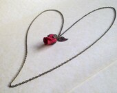 Valentine's Gift Long necklace featuring fabric rosebud  with brass leaf and sepals -'The Brass Rose'