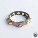 Shiny bronze leather spiked bracelet