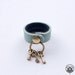 Lt. turquoise leather ring with key charm