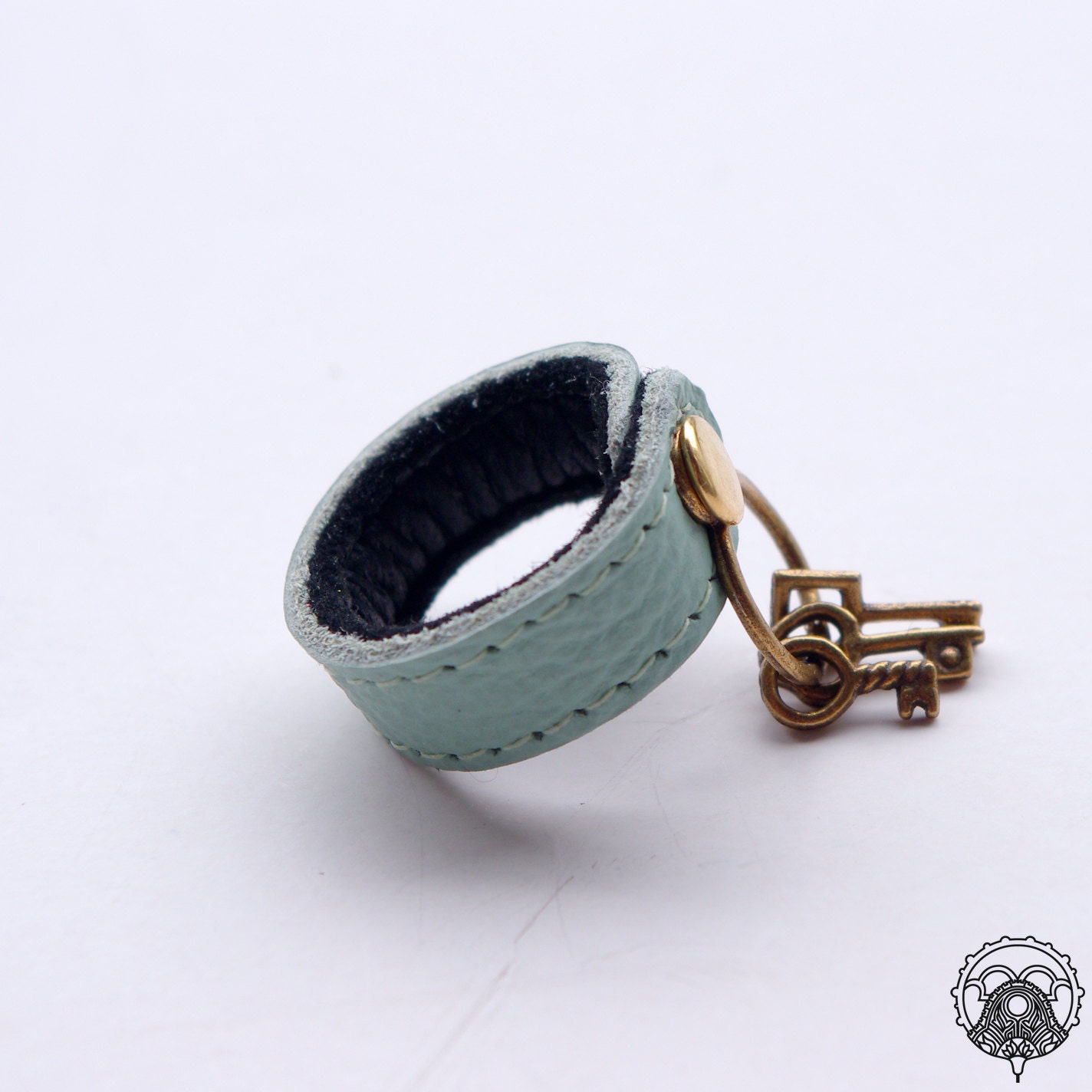 Lt. turquoise leather ring with key charm