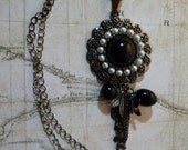 Flower pendant necklace in silver and black by vintagerust