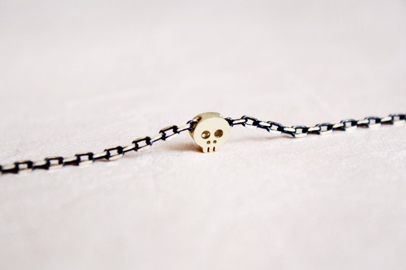 tiny skull bracelet - matt 14kt gold plated skull on BLACK chain