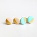 gold dipped mint green disc - geometric studs