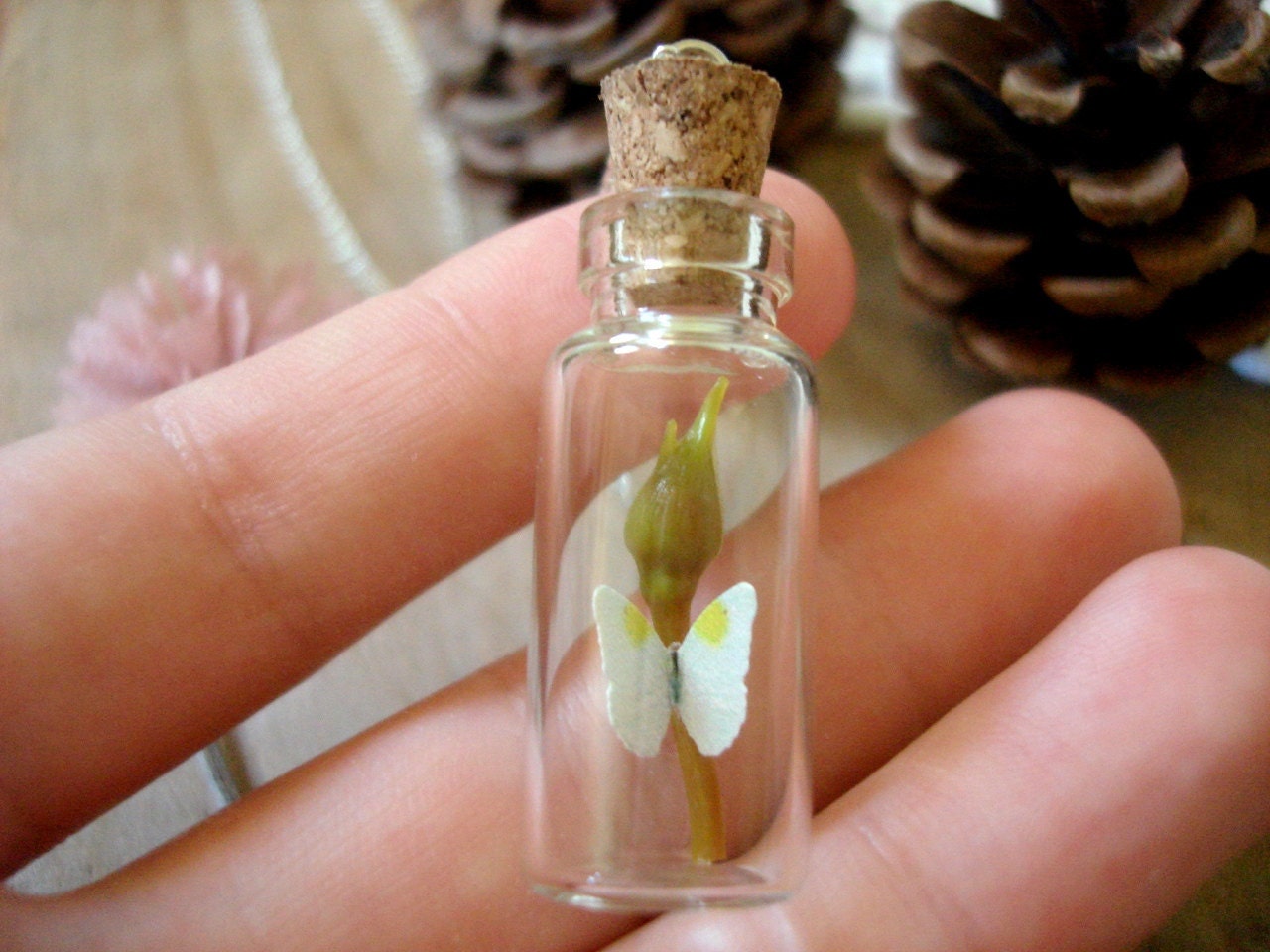 White Butterfly With Yellow Spots Sitting Atop A Rose Bud Miniature Terrarium Necklace Glass Vial - Woodland Apothecary