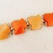 1960s lucite large leaf orange bracelet. SMOLDERING HUES.