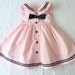 Pink and black baby sailor nautical dress, 12 months. Sleeveless, empire-waist, square sailor collar and a little black bow