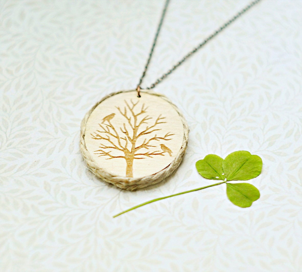 Wood Laser cut Pendant with engraved autumn tree and the edge of the twine