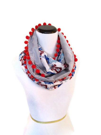 Infinity Circle Scarf with pom pom accents.