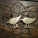 Antiqued gold tone bird earrings