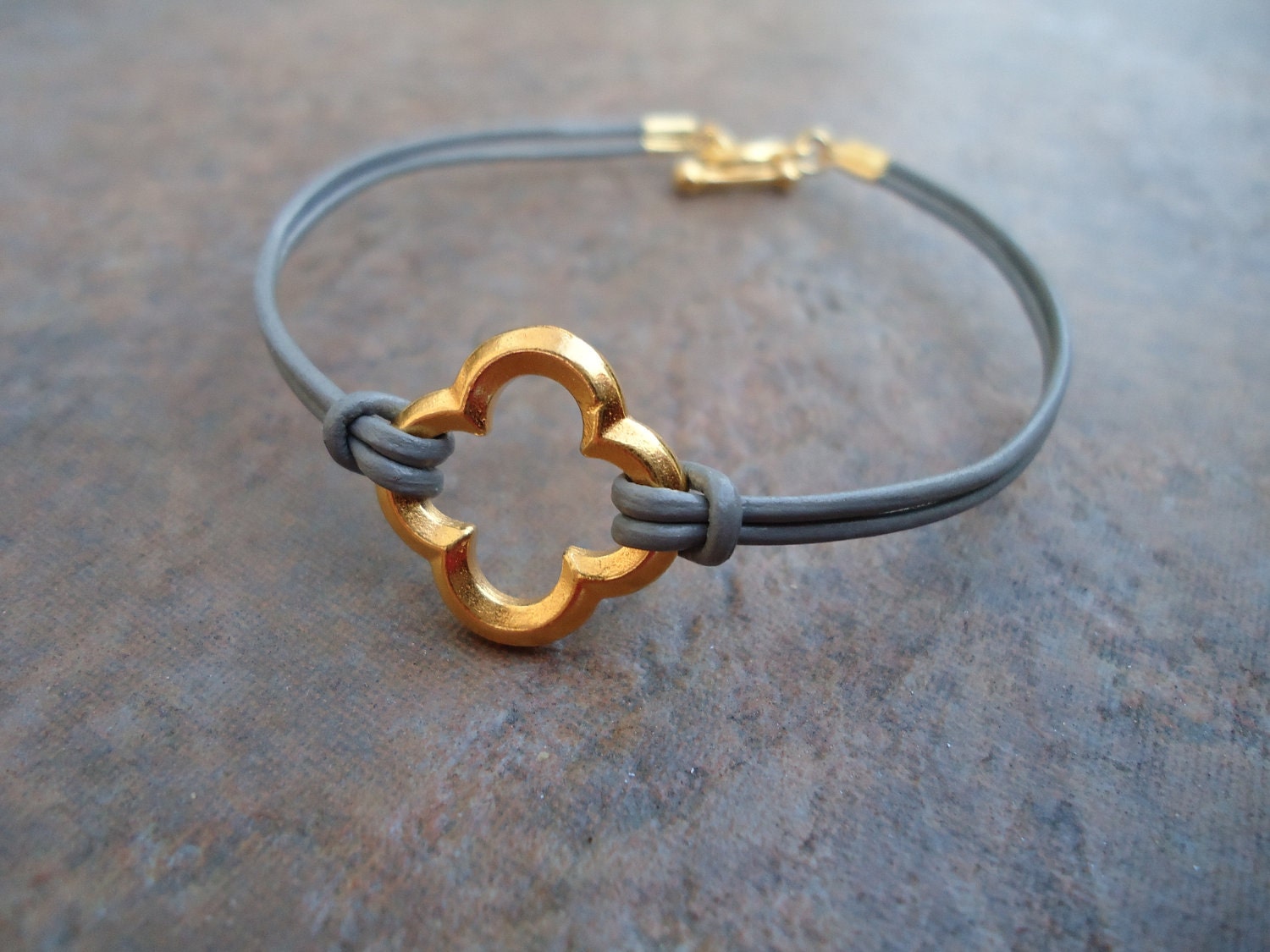 Grey Leather Gold Quatrefoil Clover Bracelet
