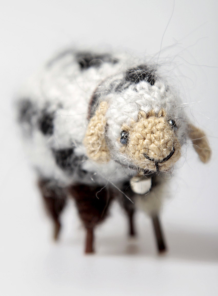 Small sheep made from wool decorated with beads, wood and tinkler
