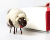 Small sheep made from wool decorated with beads, wood and tinkler