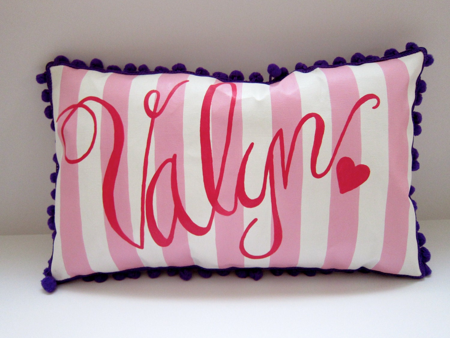 Personalized baby pillow in pink stripes and hot pink swirly script