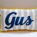 Baby pillow in light gray stripes and navy blue script. Personalized with name.