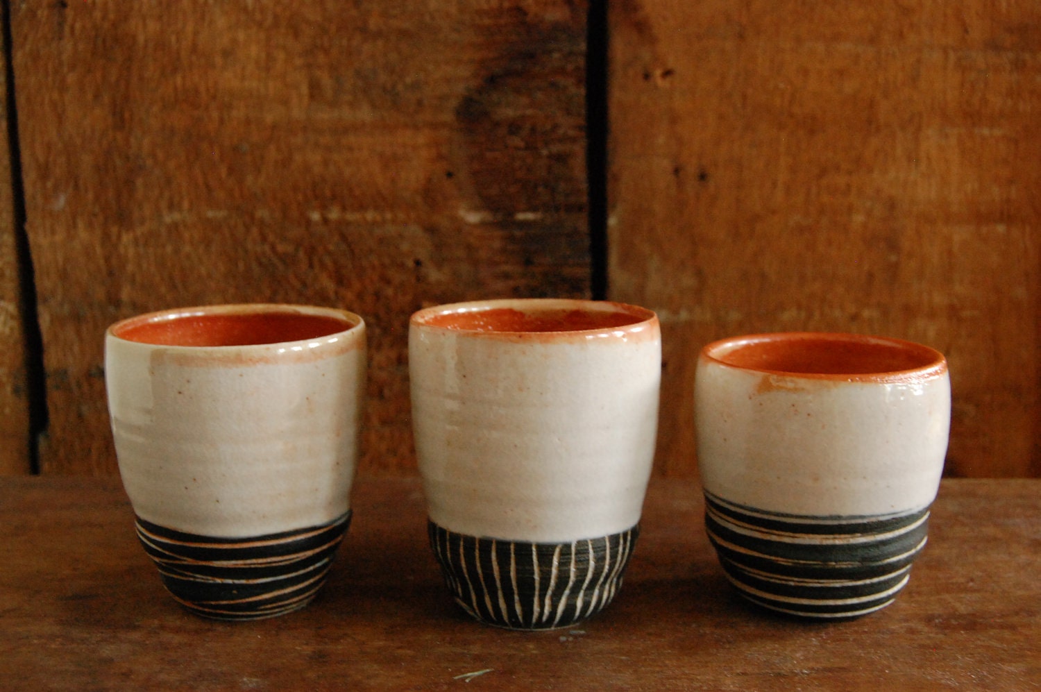 Set of three black and white carved mini tumblers