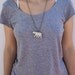 Polar bear pendant. White porcelain necklace.