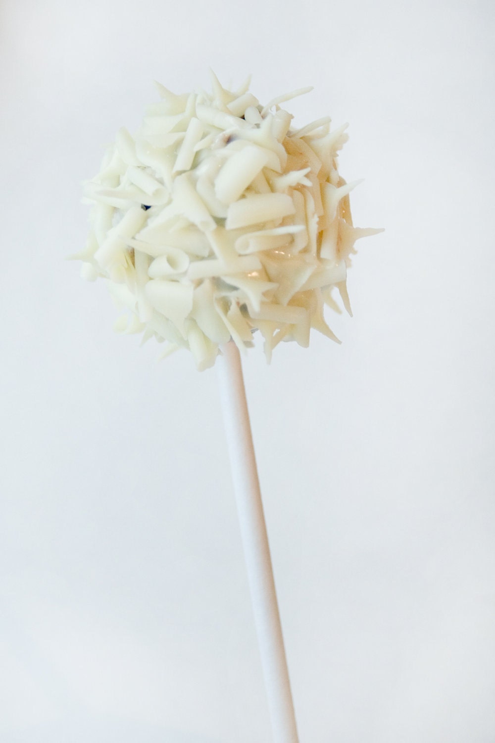 Rich homemade chocolate truffle pop coated in white chocolate and white chocolate curls - 6 - Trufflicious