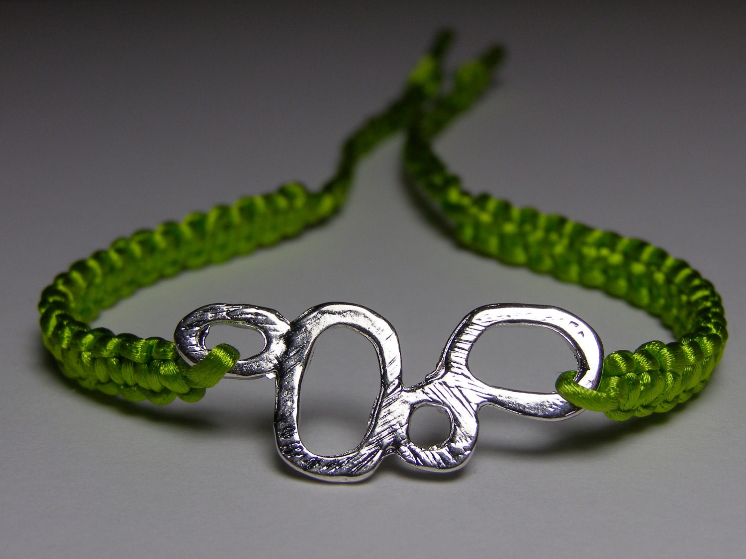 Lime green satin bracelet with silvery finding