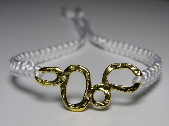 White bracelet with bubbly goldish finding
