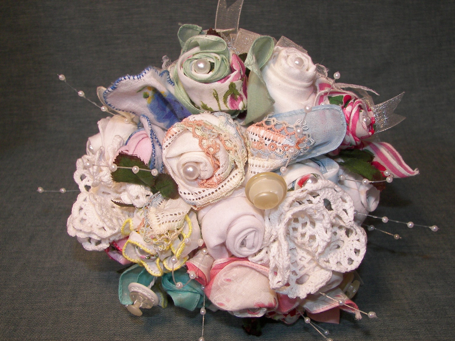 Handmade bridal bouquet designed with "hankie roses" created from vintage handkerchiefs, shabby chic buttons, lace and doilies