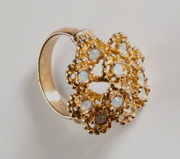 18 Karat gold glamour cocktail ring with faux opals.